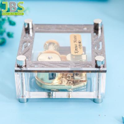 China Suitable For Any Occasions Clear Acrylic Square Shape Mini Music Box For Home Decoration Or Gift for sale