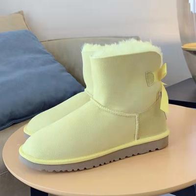 China Damping 2021 Wholesale Custom Fashion Sheepskin Snow Boots Women Girls Winter Snow Boots Wool Fur Casual Boots With Bows for sale