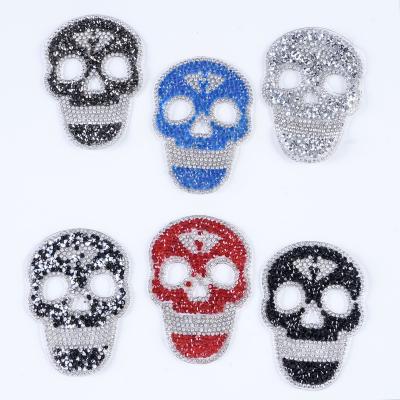 China 3D Custom Iron on punk style rhinestone skull bone design DIY Crystal Rhinestone for Garment for sale