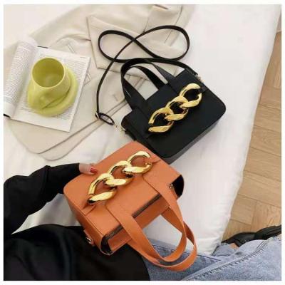 China 2021 new twist decoration metal twist decoration design handbag fashion shoulder handbag 2pcs set for sale