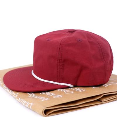 China Custom 5 Panel Fashion PVC JOINT Logo Laser Cut Perforated Hole Dad Hat Rose Water Proof Baseball Trucker Hat for sale