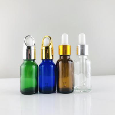 China Personal Care Amber Blue Green Clear Color 50ml 100ml Essential Oil Glass Bottle With Dropper for sale