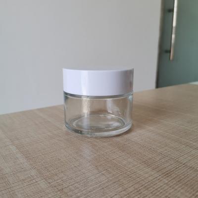 China Personal Care 30g 50g 80g 100g Face Cream Glass Jar Glass Cosmetic Jar With Plastic Cap for sale