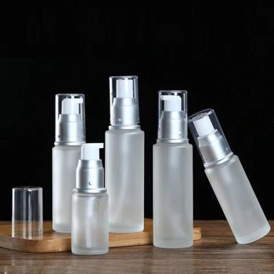 China Personal Care Lotion Spray Bottles Glass Frosted Cosmetic Bottle With Pump Cap for sale