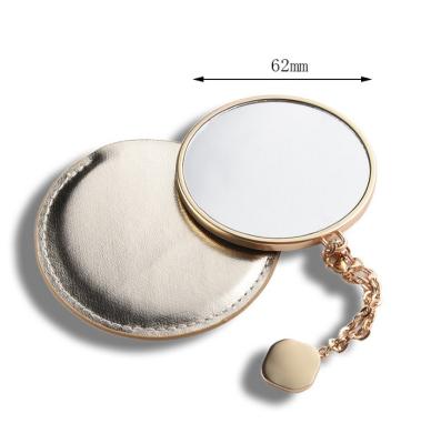 China Hot Selling Shiny Mirror Lighted Matt Gold Metal Makeup Compact Pocket PU Pocket Mirror With Pedant Chain for sale