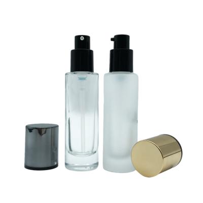 China Cosmetic Luxury Cosmetics Packaging Cylinder 30ml Liquid Base Serum Glass Pump Bottle for sale