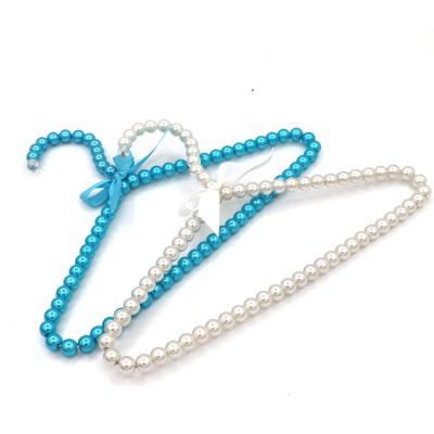 China Amazon CLASSIC Hot Selling Plastic ABS Pearl Kids Clothes Beaded Childrren's Pearl Coat Hanger for sale