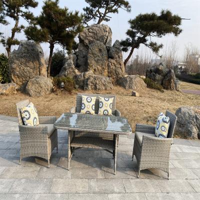 China Modern Furniture Rttan Garden Chair Modern Wicker Sofa Seat Customized Logo Steel Frame Four Piece Set for sale