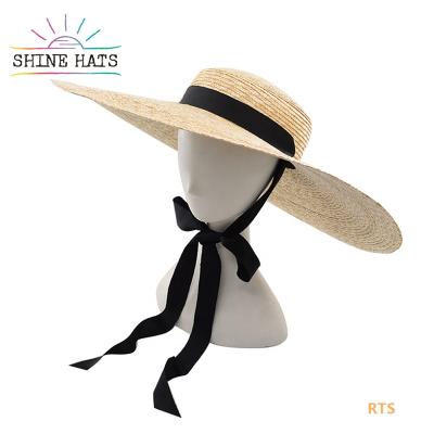 China Women Luxury Natural Wide Brim Summer Beach Sun Character Straw Hat Ribbon Flat Surface Straw Hat Wheat Custom Logo 3-5 Days for sale