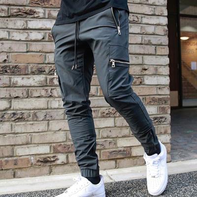 China Breathable Men Track Pants New Style Solid Pants Sports Zipper Pockets Training Casual Pants for sale