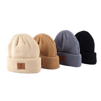 China JOINT Wholesale Custom Leather Patch Designer Logo Knitted Ribbed Hat Mens Winter Beanie for sale