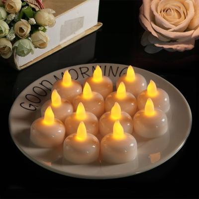 China Weddings Water Activated LED Tea Light Yellow Flickering Waterproof Floating LED Candle Tealight Small Battery Cable Candle Light for sale