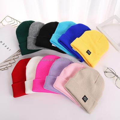 China New COMMON Wholesale Smiling Face Winter Hats With Label Candy Color Fashion Wool Beanie Knitting Hat Warm Windproof Custom Caps for sale