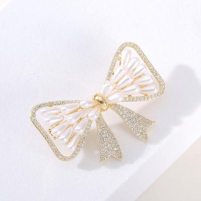 China COPPER Linked Jewelry Cute Exquisite Zircon Brooch Gold Plated Bow Knot Tassel Brooches For Jewelry for sale