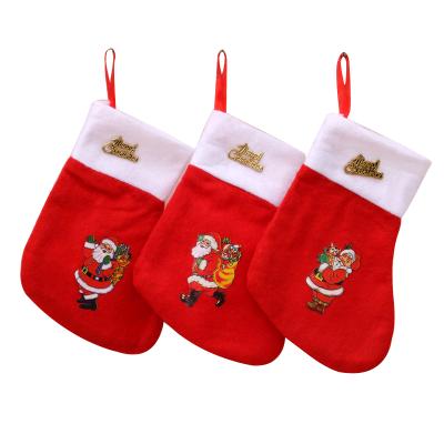 China Nonwoven Fabric Christmas Socks Christmas Gift Bag Santa Claus Bag Christmas Decoration Red Nonwoven Socks for sale