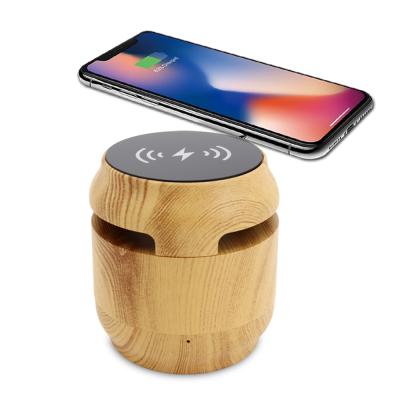 China Wireless charger for mobile phone cheap price round portable blue wireless boombox bluetooth speaker with wireless charger for sale