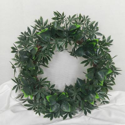 China Cheap Plastic Artificial Boxwood Christmas Green Leaves Wall Decor Window Door Hanging Garland Holiday Wedding Price for sale