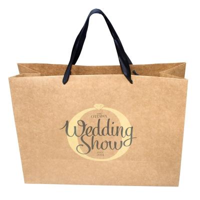 China Disposable Customize Ribbon Handle Kraft Paper Promotion Shopping Bag With Design LOGO for sale