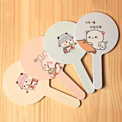 China Custom Logo Small Portable Hand Held Mirror Private Label Round Hand Held Cosmetic Mirror for sale