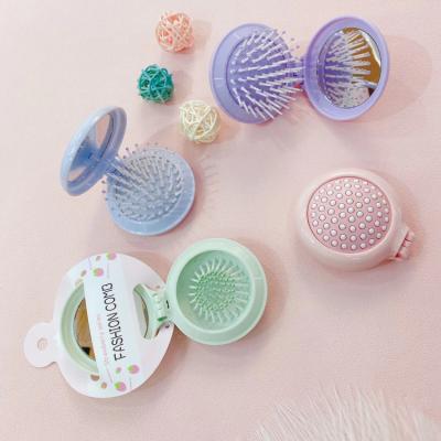 China Foldable Travel Small Logo Private Label Detangling Comb Custom Foldable Macaron Hair Comb Brush With Pocket Mirror for sale