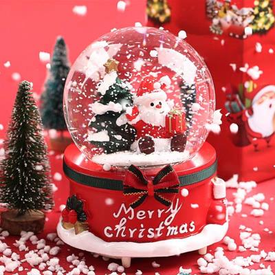 China Musical Christmas Gift Resin Crystal Ball Music Box Resin Snow Globe Musical Crystal Ball For Home Decor for sale