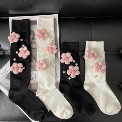 China Three-dimensional sports cute and sweet pearl flower calf knee length thongs black and white women's socks for sale