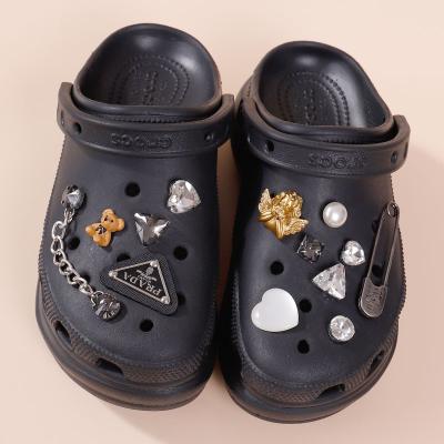 China Custom Flower Summer Shoe Crystal Angel Buckle Cave Shoe Triangle Charm Clog Sandals Cool Accessories Support for sale