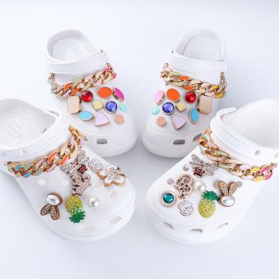 China Custom Clog Charm 2022 Wholesale Bling Crystal Alloy Custom Brand Logo For Croc Sandals Charm New Designer Shoe Charms For Women for sale