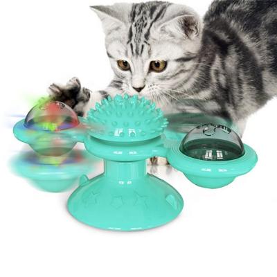 China Viable Home Turntable Pet Teasing Toy with Scratching Tickling Cats Hair Brush Glowing Ball for sale