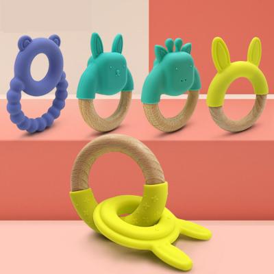 China Amazon Safety Hot Selling Natural Orgnanic Silicone Wooden Toddler Teething Ring Baby Rattle Silicone Baby Teething Teether Toy for sale