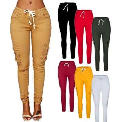 China Breathable Ladies Casual Pencil Pants Solid Color Multi Pocket Autumn Women Drawstring Trousers for sale