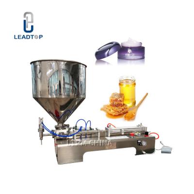 China Quantitative Dispensing Edible Oil Filling Machine 50W With 30L Hopper for sale