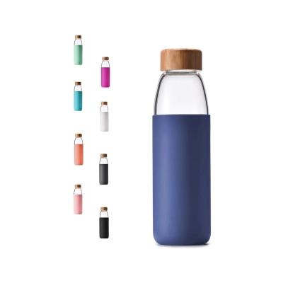 China Contemporary 18 Ounce Borosilicate Glass BPA Free Water Bottles With Bamboo Lid Portable Colorful Glass Water Bottle For Water Juice for sale