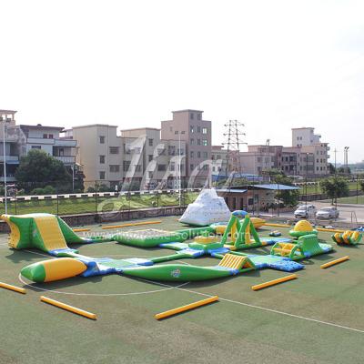 China Water Entertainment Happy Inflatable Water Island World with Rolling Hills and Floating Slide for Lake for sale