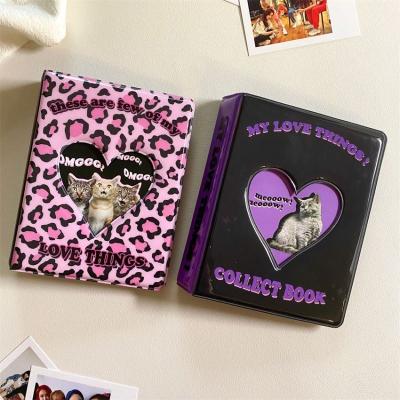 China Soft Cloth Cartoon Printing Mini Photo Holder Album Collecting Book With Metal Gold Heart Hollow Hole 3inch Pocket for sale