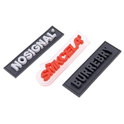 China Handmade Custom Soft Silicon Logo Patches Clothing Designer Letter Patches 3D Garment PVC Patches for sale