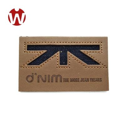 China Viable Style Logo Design Leather Label For Custom Embossed Jeans for sale