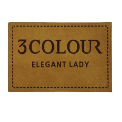 China Good quality washable custom cheap embossed real leather label patch for hat clothing bag for sale