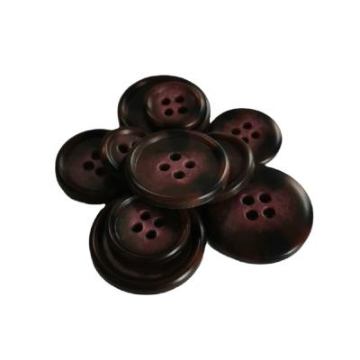 China Sustainable Good Quality Four Holes Sewing Carbamide Resin Customer Button for sale