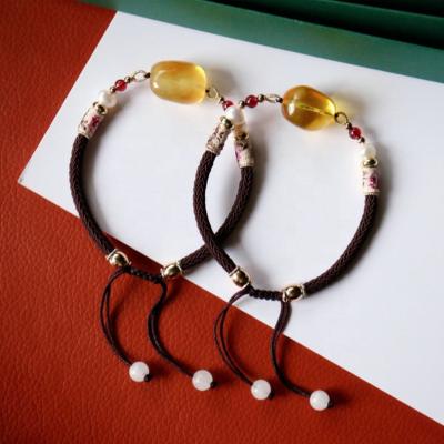 China Garnet Big Natural Amber Woven Pearl Romantic Ethnic Bracelet For Couples Lovers for sale