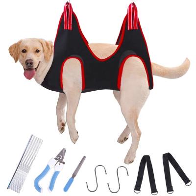 China Viable Pet Grooming Kit Dog Cat Nail Cutter Grinder Comb Grooming Aid Dog Hair Trimming Hammock Set for sale