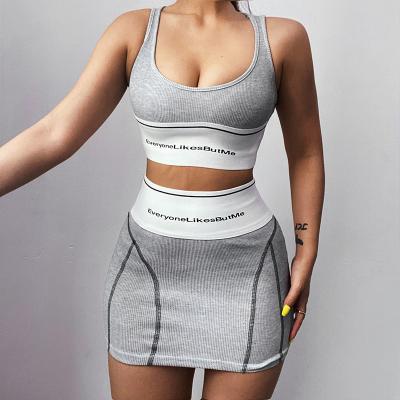 China QUICK DRY summer women's active wear two-piece outfit of logo crop top halter and short pull-on styling elasticized waist with skirt set for sale