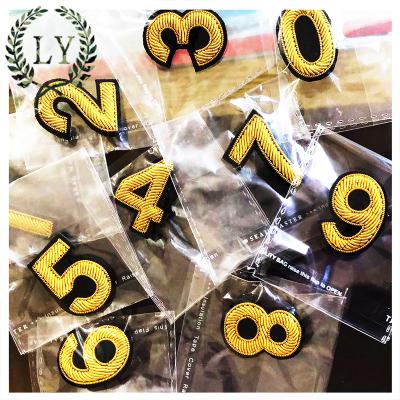 China Custom Handcrafted Letters Bullion Thread Embroidery Patch With Safety Pin for sale