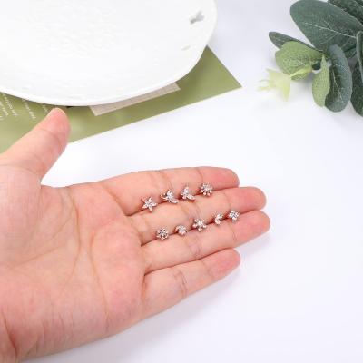 China TRENDY Stainless Steel L Shape Flower Nose Plant 18k Rings Sets Lightning Diamond Piercing Stud Earrings Women Lip Sting Jewelry for sale