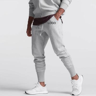 China Customized Anti-pilling Plain Sweat Gym Running Jogger Pants Mens Cotton Pants Mens Solid Sportswear Workout Slim Pants Track Pants For Men for sale