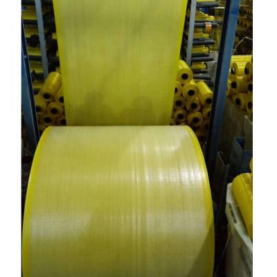 China Good New Quality 100% Recyclable Material Transparent Yellow Color PP Woven To Roll Tubular Cloth For Grain, Feed, Seed for sale