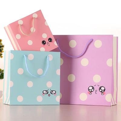 China Recyclable Funny Expressions Dots Cosmetic Packaging Bag Paper Carry Bag Gift for sale