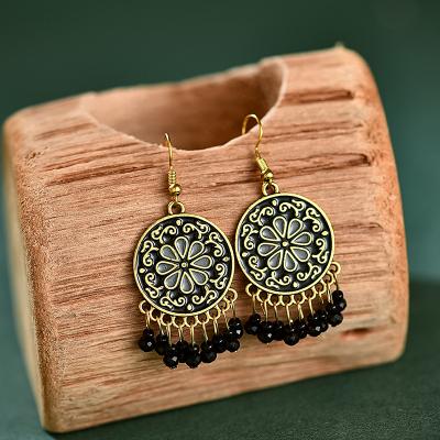 China New Retro Chinese style boho style disc engraved hanging pearl tassel hanging hollow woven earrings for sale