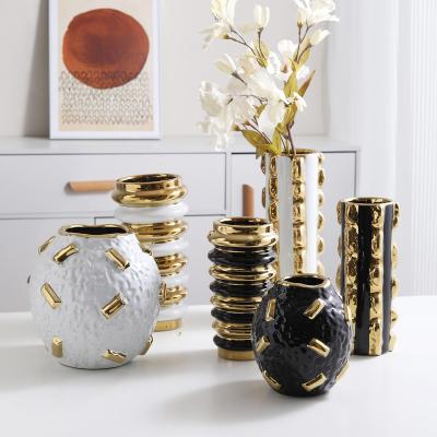 China Modern Pattern Decoration Luxury Ceramic Vase Plating Table Top White And Black Gold Handcrafted Vases for sale