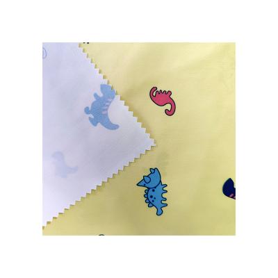 China Waterproof High Quality 100% Polyester Cartoon Dinosaur Printed Pattern Printed Recycled Fabrics for sale